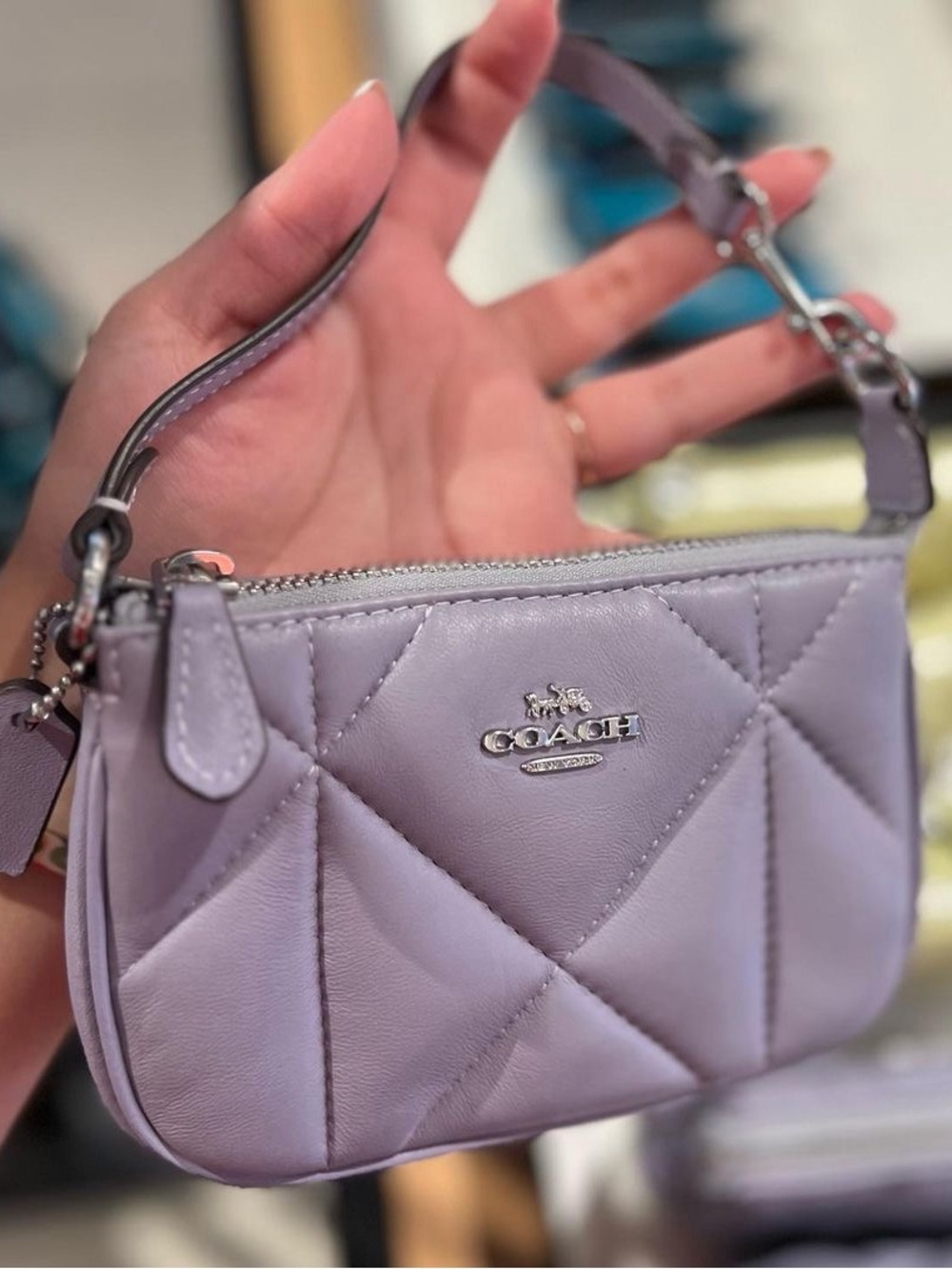 This is the Coach Nolita 15 Puffy Diamond Quiliting handbag.